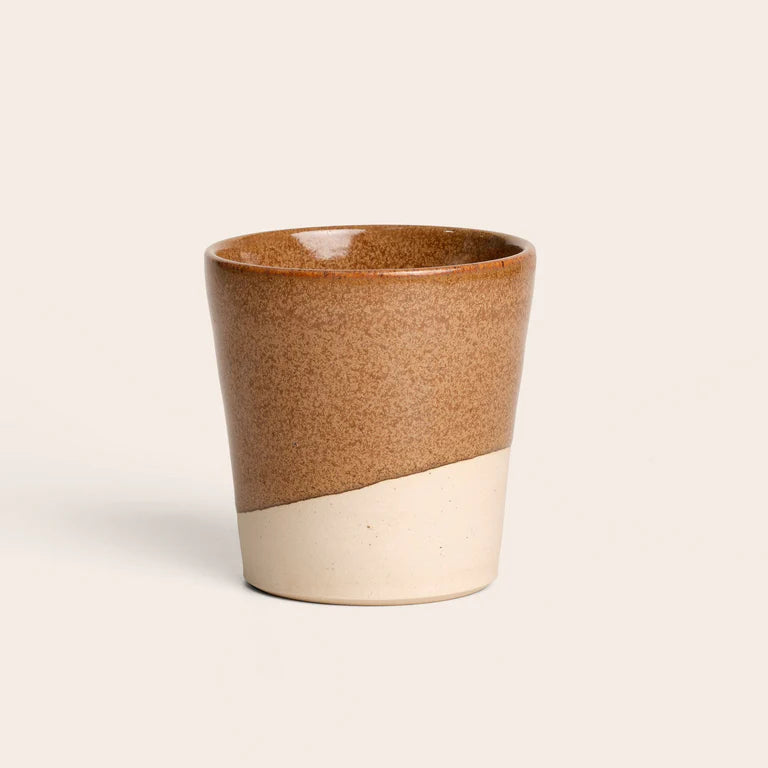 Brown ceramic coffee cup