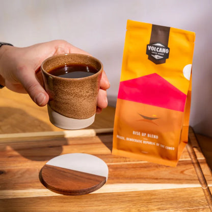 Brown ceramic coffee cup