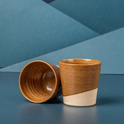 Brown ceramic coffee cup